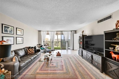 This fully remodeled unit features an open kitchen with white on Palm-Aire Country Club and Resort - Palms in Florida - for sale on GolfHomes.com, golf home, golf lot