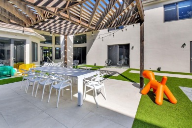 Experience luxury living at its finest in this elegant & on Broken Sound Golf and Club  in Florida - for sale on GolfHomes.com, golf home, golf lot