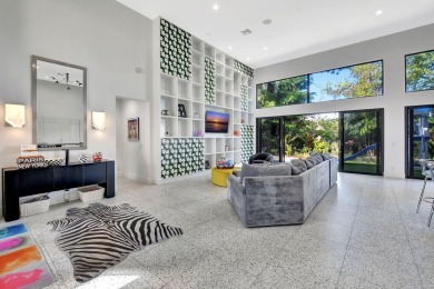 Experience luxury living at its finest in this elegant & on Broken Sound Golf and Club  in Florida - for sale on GolfHomes.com, golf home, golf lot