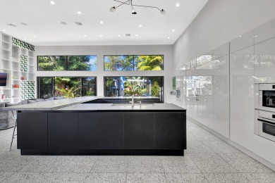 Experience luxury living at its finest in this elegant & on Broken Sound Golf and Club  in Florida - for sale on GolfHomes.com, golf home, golf lot