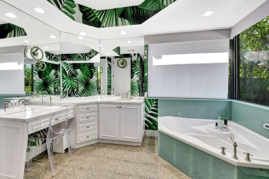 Experience luxury living at its finest in this elegant & on Broken Sound Golf and Club  in Florida - for sale on GolfHomes.com, golf home, golf lot