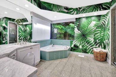 Experience luxury living at its finest in this elegant & on Broken Sound Golf and Club  in Florida - for sale on GolfHomes.com, golf home, golf lot