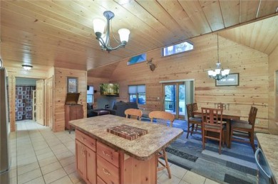 Experience the charm of this stunning log home on Northwood on Hardwoods Golf Club At Mille Lacs in Minnesota - for sale on GolfHomes.com, golf home, golf lot