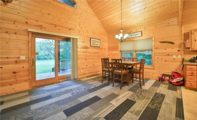 Experience the charm of this stunning log home on Northwood on Hardwoods Golf Club At Mille Lacs in Minnesota - for sale on GolfHomes.com, golf home, golf lot