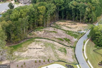 Large cleared lot in coveted Governors Towne Club community on The Governors Towne Club in Georgia - for sale on GolfHomes.com, golf home, golf lot