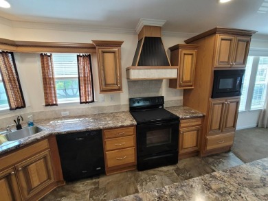 Looking for that big home? This 3/2 home has at least 1700 sq ft on Pelican Pointe 9 Hole Course in Florida - for sale on GolfHomes.com, golf home, golf lot