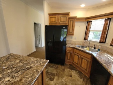 Looking for that big home? This 3/2 home has at least 1700 sq ft on Pelican Pointe 9 Hole Course in Florida - for sale on GolfHomes.com, golf home, golf lot