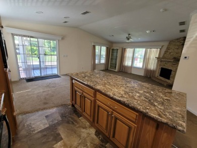Looking for that big home? This 3/2 home has at least 1700 sq ft on Pelican Pointe 9 Hole Course in Florida - for sale on GolfHomes.com, golf home, golf lot