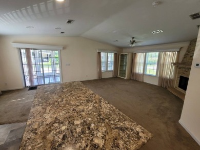 Looking for that big home? This 3/2 home has at least 1700 sq ft on Pelican Pointe 9 Hole Course in Florida - for sale on GolfHomes.com, golf home, golf lot