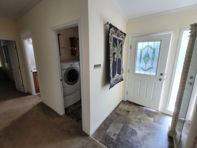 Looking for that big home? This 3/2 home has at least 1700 sq ft on Pelican Pointe 9 Hole Course in Florida - for sale on GolfHomes.com, golf home, golf lot