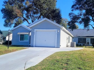 This great site-built home includes the golf cart in the garage on Chula Vista Executive Golf Course in Florida - for sale on GolfHomes.com, golf home, golf lot