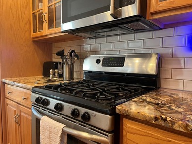 Charming 4BR/3BA brick home overlooking the signature 16th hole on Glade Springs Resort Golf Course in West Virginia - for sale on GolfHomes.com, golf home, golf lot