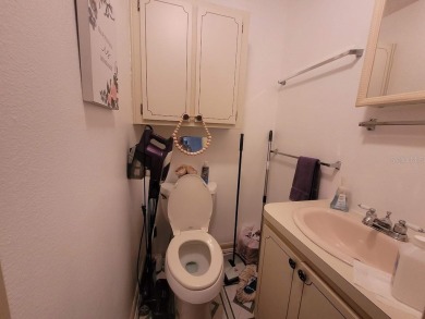 This manufactured home has a carport and a golf cart garage with on Orange Blossom Hills Golf and Country Club in Florida - for sale on GolfHomes.com, golf home, golf lot