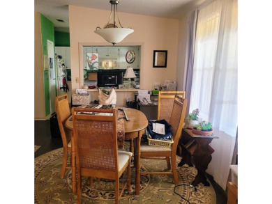 This manufactured home has a carport and a golf cart garage with on Orange Blossom Hills Golf and Country Club in Florida - for sale on GolfHomes.com, golf home, golf lot