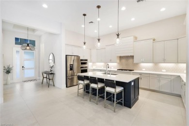 Discover this Beautiful Modern Elegant home in the exclusive on The Golf Club At Fiddlers Creek in Florida - for sale on GolfHomes.com, golf home, golf lot