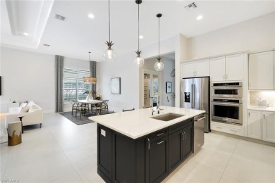 Discover this Beautiful Modern Elegant home in the exclusive on The Golf Club At Fiddlers Creek in Florida - for sale on GolfHomes.com, golf home, golf lot