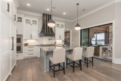 STUNNING LAKEFRONT LIVING AWAITS YOU! This bespoke custom on Reynolds Lake Oconee - The Oconee in Georgia - for sale on GolfHomes.com, golf home, golf lot