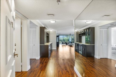 Freshly Painted, Laminate Floors Built-in Bar. Kitchen with on Boca Pointe Country Club in Florida - for sale on GolfHomes.com, golf home, golf lot