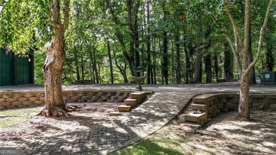 Experience ultimate privacy and breathtaking views from this on The Highlands Course at Lake Arrowhead in Georgia - for sale on GolfHomes.com, golf home, golf lot