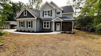Welcome to this stunning new home nestled on a spacious, wooded on Zebulon Country Club in North Carolina - for sale on GolfHomes.com, golf home, golf lot