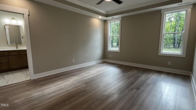 Welcome to this stunning new home nestled on a spacious, wooded on Zebulon Country Club in North Carolina - for sale on GolfHomes.com, golf home, golf lot