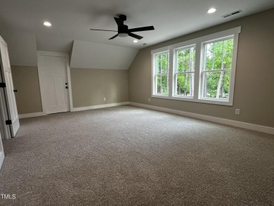 Welcome to this stunning new home nestled on a spacious, wooded on Zebulon Country Club in North Carolina - for sale on GolfHomes.com, golf home, golf lot