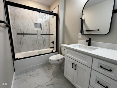 Welcome to this stunning new home nestled on a spacious, wooded on Zebulon Country Club in North Carolina - for sale on GolfHomes.com, golf home, golf lot