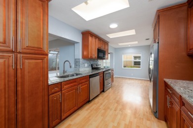 GORGEOUS, UPDATED, SKYLIGHTS, FANS, FRESHLY PAINTED, SCREENED on Forest Oaks Golf Club in Florida - for sale on GolfHomes.com, golf home, golf lot