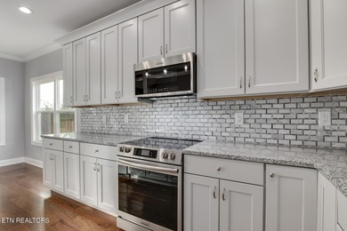 Located on a professionally landscaped corner lot in Tellico on Toqua Golf Course - Loudon County in Tennessee - for sale on GolfHomes.com, golf home, golf lot