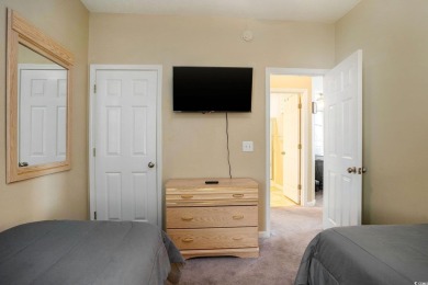 This bright 2 bedroom, 2 bath end unit in the desirable River on River Oaks Golf Plantation  in South Carolina - for sale on GolfHomes.com, golf home, golf lot