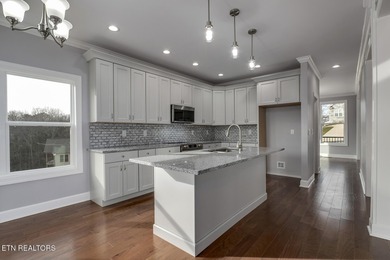 Located on a professionally landscaped corner lot in Tellico on Toqua Golf Course - Loudon County in Tennessee - for sale on GolfHomes.com, golf home, golf lot