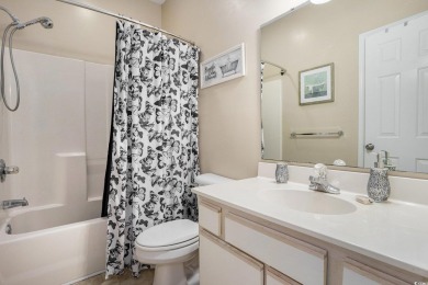 This bright 2 bedroom, 2 bath end unit in the desirable River on River Oaks Golf Plantation  in South Carolina - for sale on GolfHomes.com, golf home, golf lot