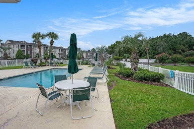 This bright 2 bedroom, 2 bath end unit in the desirable River on River Oaks Golf Plantation  in South Carolina - for sale on GolfHomes.com, golf home, golf lot