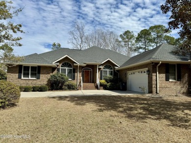 This expansive residence boasts 3 bedrooms, 3.5 bathrooms, and on Oyster Bay Golf Links in North Carolina - for sale on GolfHomes.com, golf home, golf lot