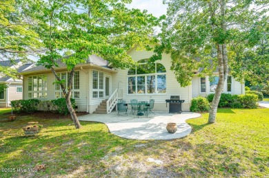 This expansive residence boasts 3 bedrooms, 3.5 bathrooms, and on Oyster Bay Golf Links in North Carolina - for sale on GolfHomes.com, golf home, golf lot