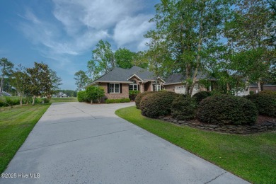 This expansive residence boasts 3 bedrooms, 3.5 bathrooms, and on Oyster Bay Golf Links in North Carolina - for sale on GolfHomes.com, golf home, golf lot