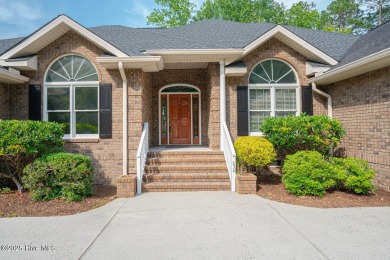 This expansive residence boasts 3 bedrooms, 3.5 bathrooms, and on Oyster Bay Golf Links in North Carolina - for sale on GolfHomes.com, golf home, golf lot