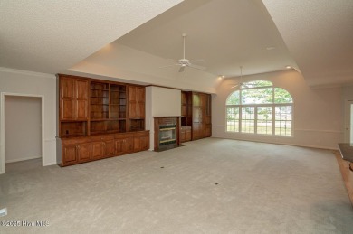 This expansive residence boasts 3 bedrooms, 3.5 bathrooms, and on Oyster Bay Golf Links in North Carolina - for sale on GolfHomes.com, golf home, golf lot