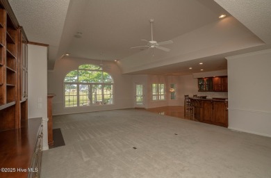This expansive residence boasts 3 bedrooms, 3.5 bathrooms, and on Oyster Bay Golf Links in North Carolina - for sale on GolfHomes.com, golf home, golf lot
