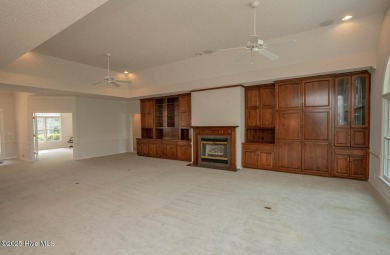 This expansive residence boasts 3 bedrooms, 3.5 bathrooms, and on Oyster Bay Golf Links in North Carolina - for sale on GolfHomes.com, golf home, golf lot
