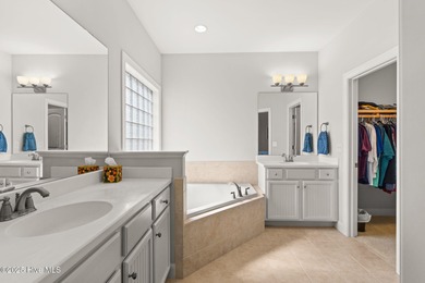 The all-brick former model home in the Regency Lakes section of on Members Club At St. James Plantation in North Carolina - for sale on GolfHomes.com, golf home, golf lot