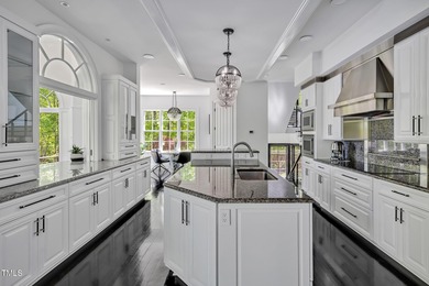 Lake Views! As the sun rises over the serene lake, it gently on Governors Club in North Carolina - for sale on GolfHomes.com, golf home, golf lot