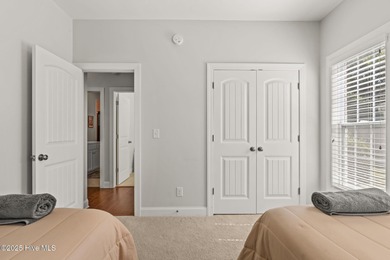 The all-brick former model home in the Regency Lakes section of on Members Club At St. James Plantation in North Carolina - for sale on GolfHomes.com, golf home, golf lot