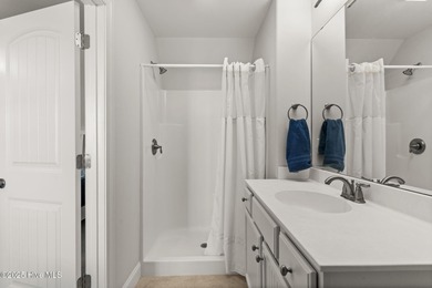 The all-brick former model home in the Regency Lakes section of on Members Club At St. James Plantation in North Carolina - for sale on GolfHomes.com, golf home, golf lot