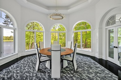 Lake Views! As the sun rises over the serene lake, it gently on Governors Club in North Carolina - for sale on GolfHomes.com, golf home, golf lot