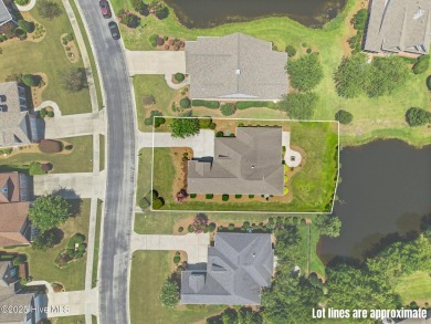 The all-brick former model home in the Regency Lakes section of on Members Club At St. James Plantation in North Carolina - for sale on GolfHomes.com, golf home, golf lot