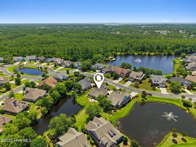 The all-brick former model home in the Regency Lakes section of on Members Club At St. James Plantation in North Carolina - for sale on GolfHomes.com, golf home, golf lot