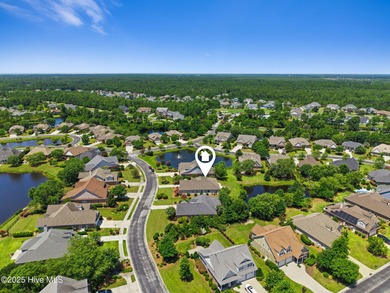 The all-brick former model home in the Regency Lakes section of on Members Club At St. James Plantation in North Carolina - for sale on GolfHomes.com, golf home, golf lot