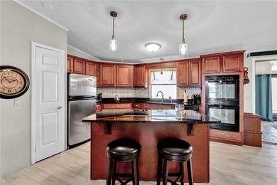 Live the dream in this beautifully updated 2BR/2BA home in on Barefoot Bay Golf Course in Florida - for sale on GolfHomes.com, golf home, golf lot