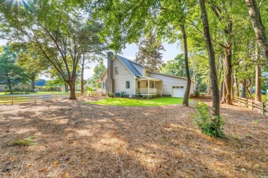 Welcome to 245 Watersedge Drive, a charming traditional home on Caledonia Golf and Fish Club in South Carolina - for sale on GolfHomes.com, golf home, golf lot